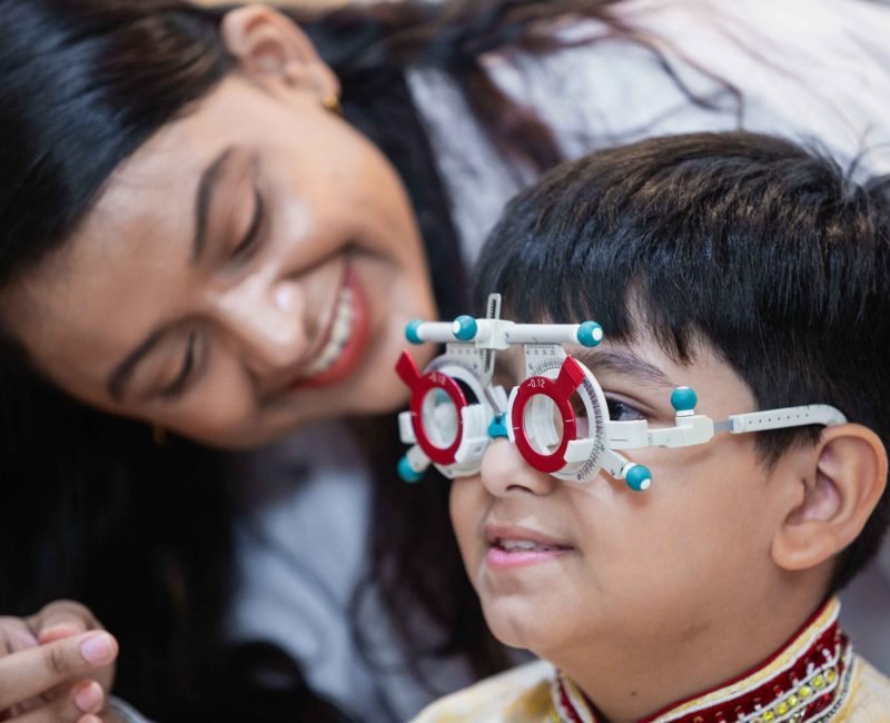 happy-indian-child-boy-with-women-eye-specialist-e-2024-03-07-19-26-54-utc_3_11zon