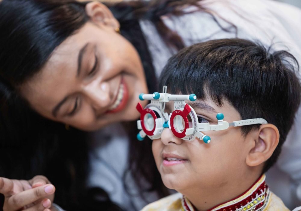 happy-indian-child-boy-with-women-eye-specialist-e-2024-03-07-19-26-54-utc_3_11zon